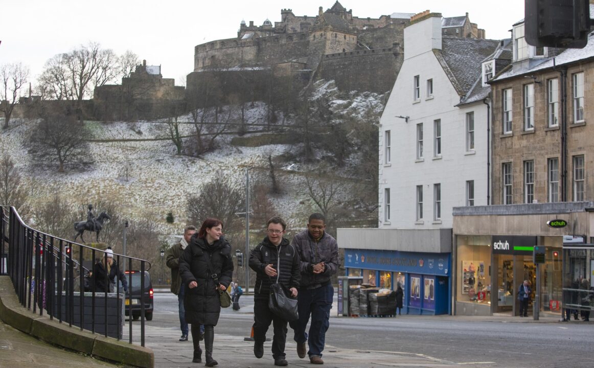 People walking along Fredrick st with Castle view