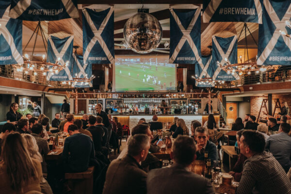 people dining and wathcing rugby at Bewhemia bar